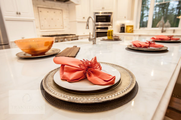 White traditional kitchen design with large island.