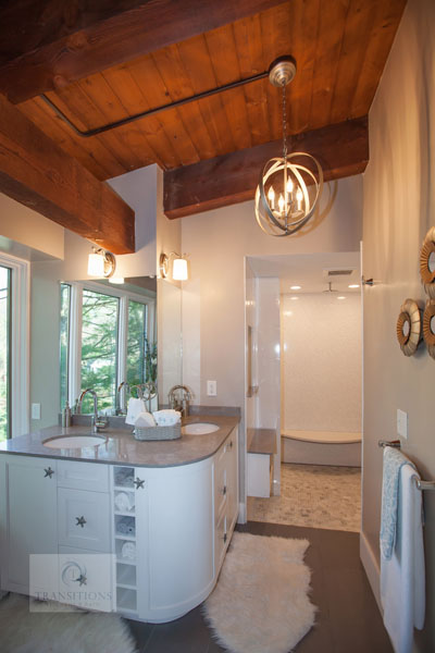 Contemporary bathroom design with rustic barn beams