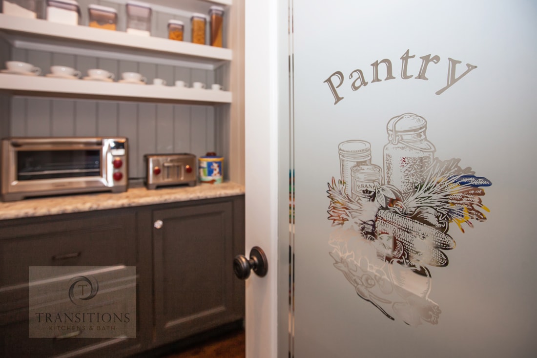 Traditional kitchen design with walk in pantry and custom door