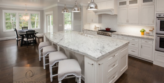 White kitchen design with large island
