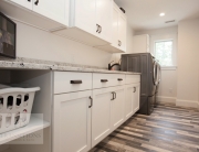 laundry room design with white cabinets