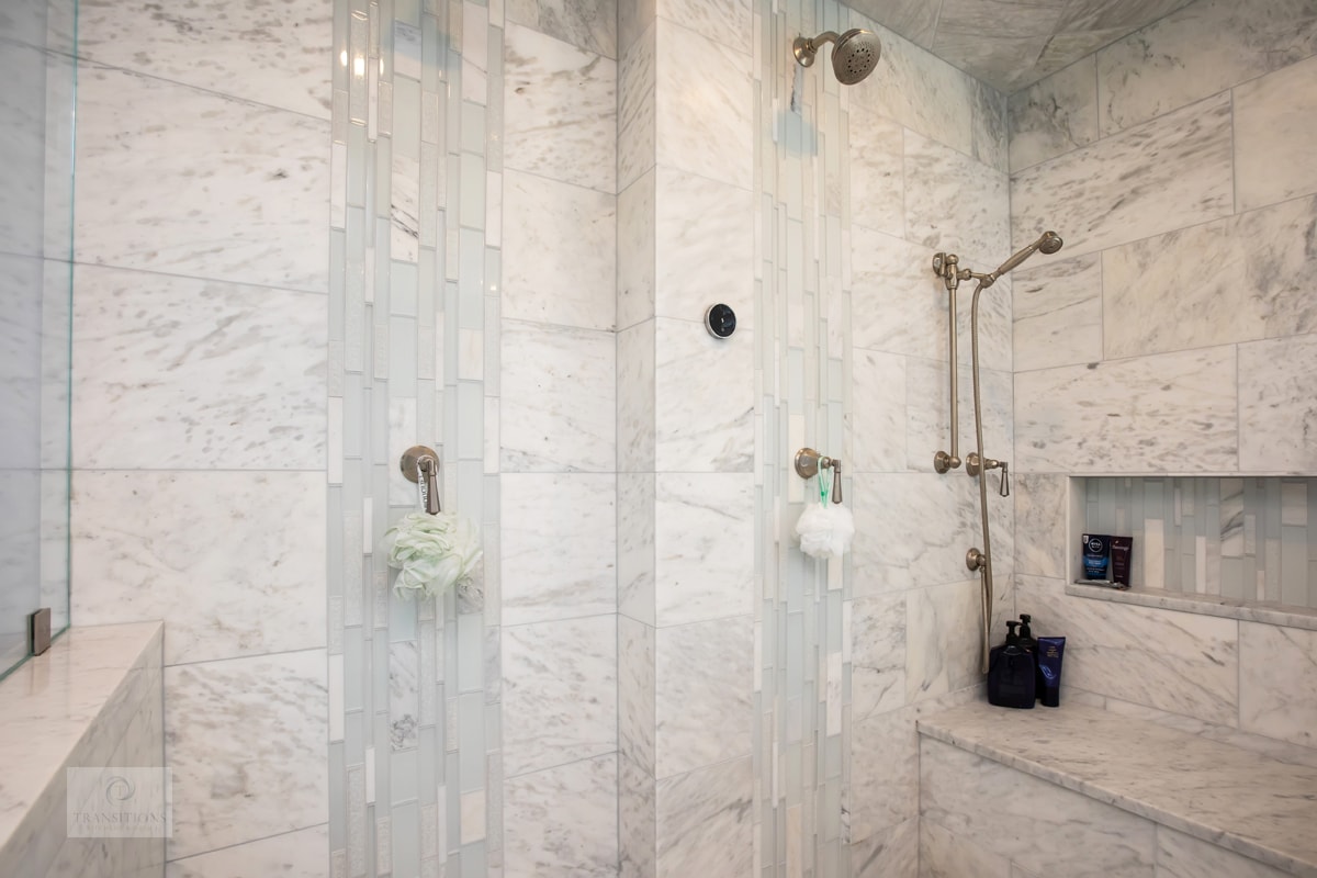 shower design with shower benches and storage niche