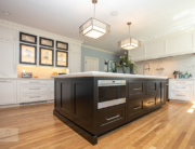 large kitchen island and glass front cabinets