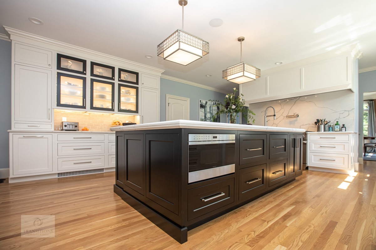 large kitchen island and glass front cabinets