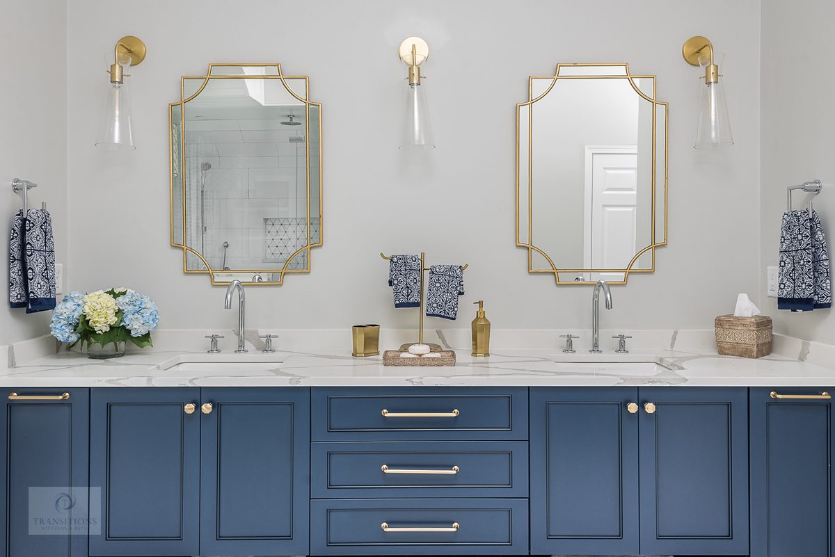 master bath with blue vanity cabinet