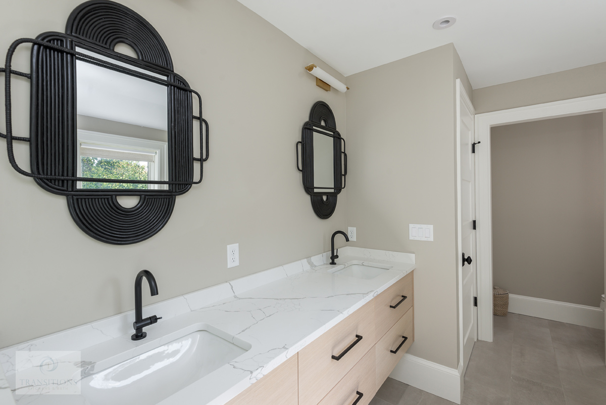 master bath design with black framed mirrors