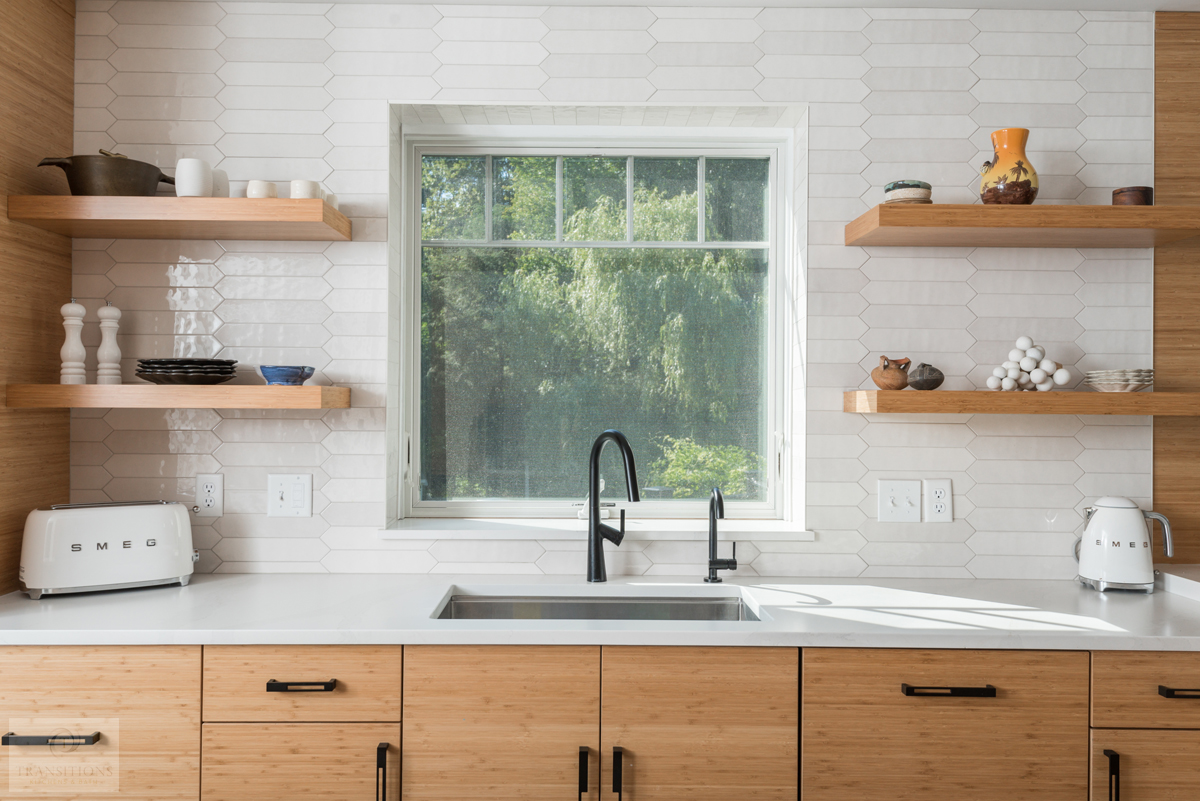 wood cabinetry and shelves with white backsplash