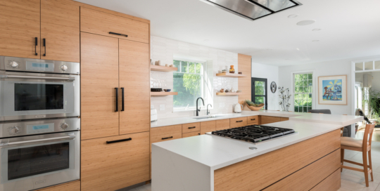 U-shaped kitchen design with modern wood cabinets